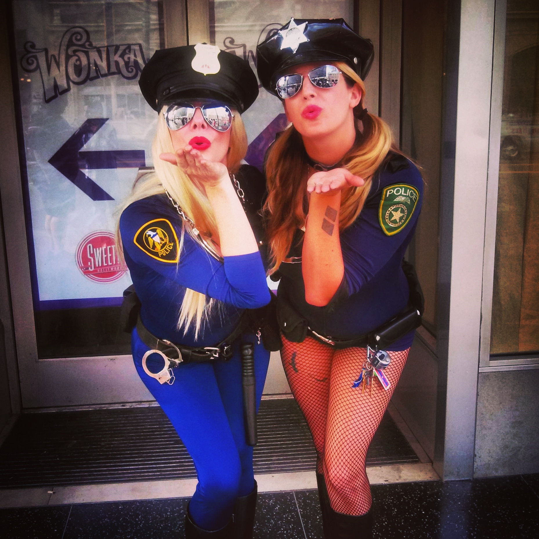 Costumed Girls on Hollywood Boulevard Blowing a Kiss